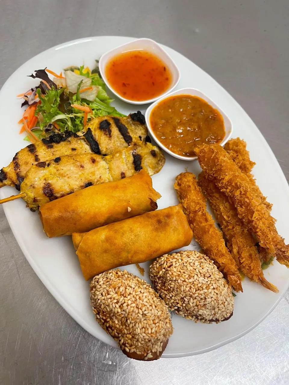 A selection of Thai starters with salad and dipping sauces
