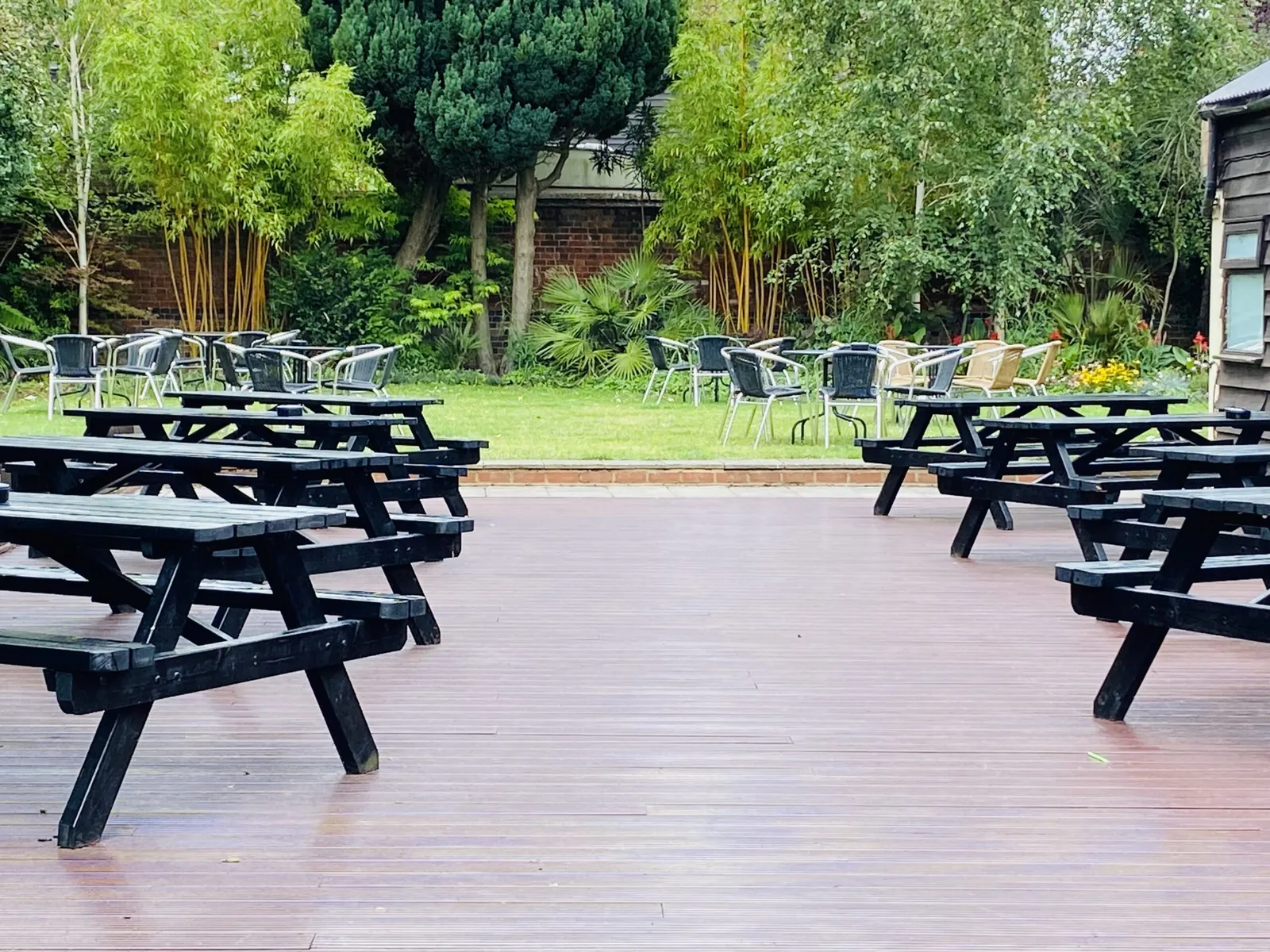 Picnic benches on the decking in the White Lion beer garden