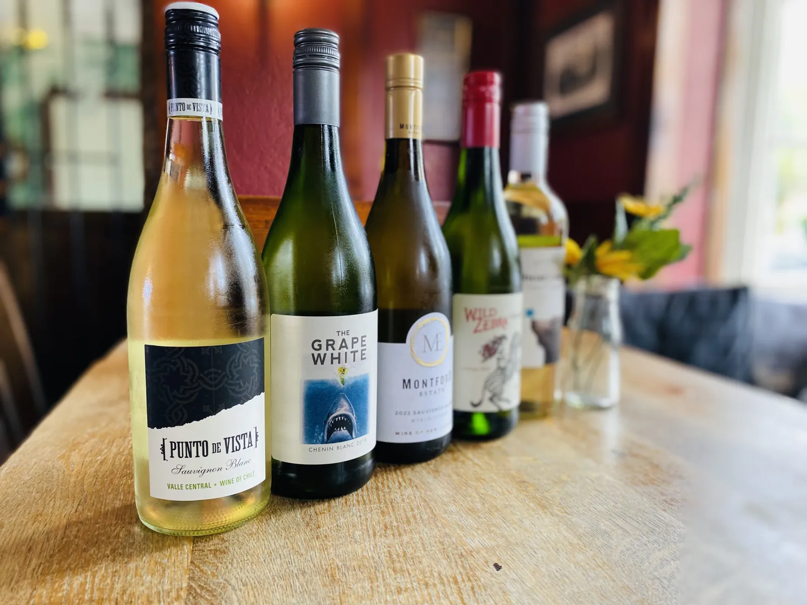 Wine bottles on the shelf behind the bar