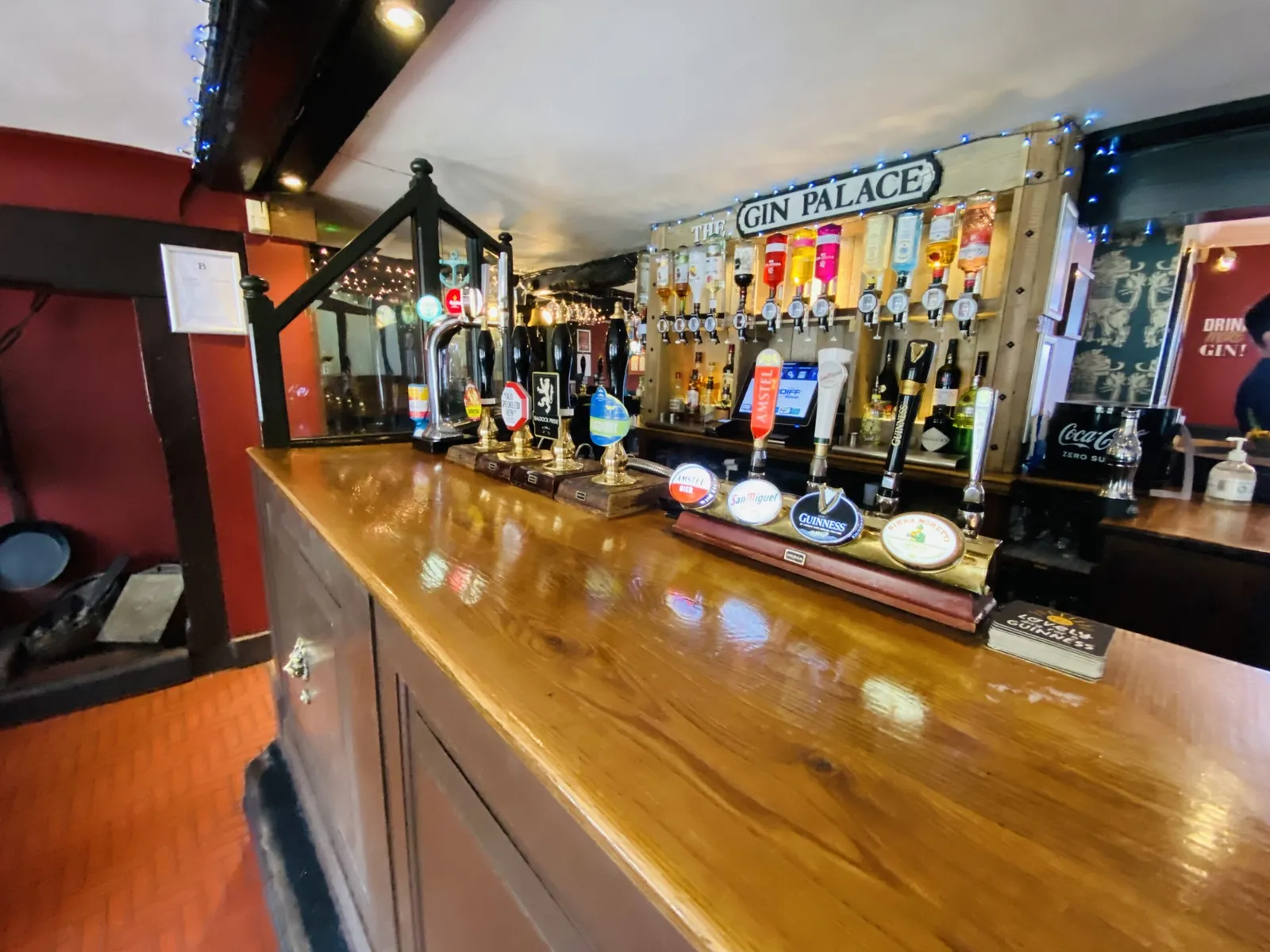 The bar room of the White Lion with stools drawn up to the counter