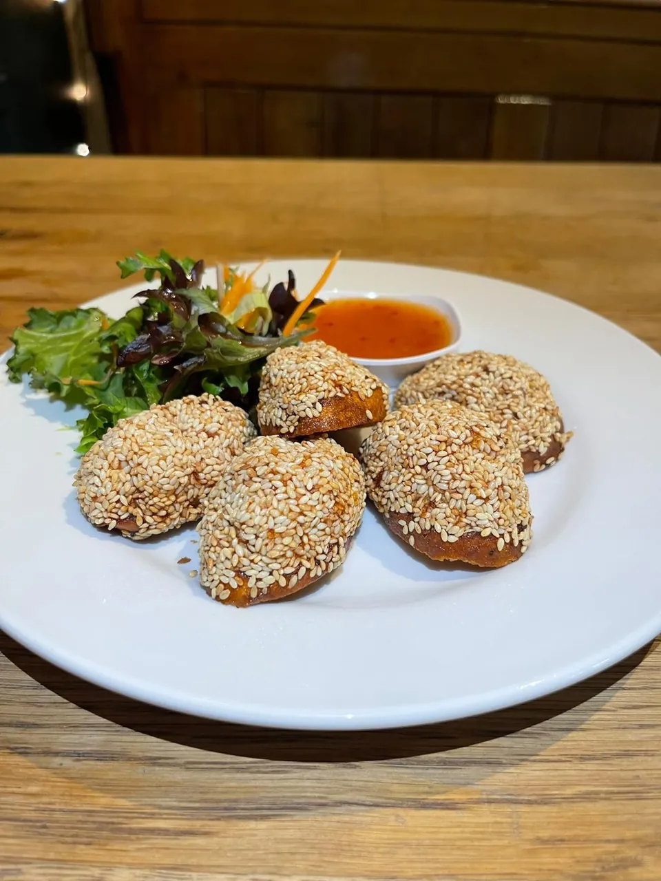 Sesame coated Thai starters with dipping sauce