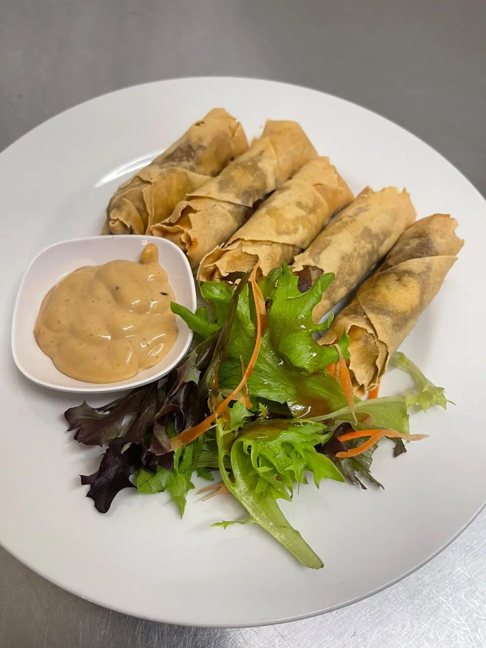 Thai spring rolls with salad and dipping sauce