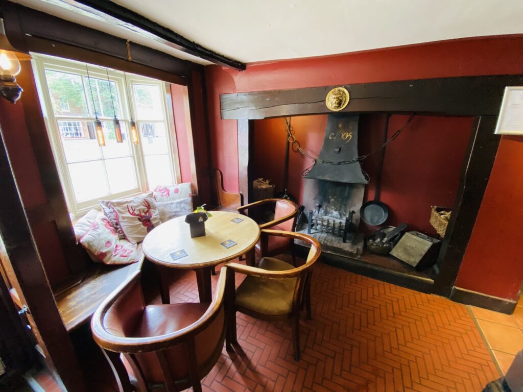 The White Lion Baldock Pub interior and historic fireplace dated 1605